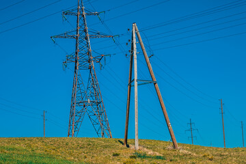 Autumn with electricity old poles and wires. In the meadow that goes home.