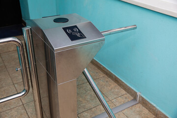Turnstile at the entrance using electronic cards.