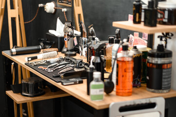 Fototapeta na wymiar Barbers tools for mens haircuts laid out on a table