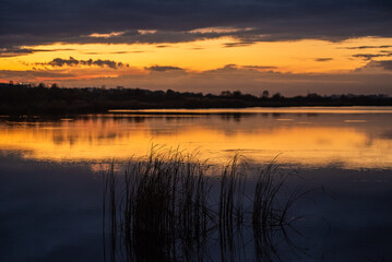 Fototapeta na wymiar sunset over the lake.tranquil landscape