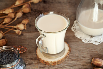Vegan poppy seed milk in a glass with seeds