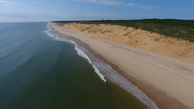 Aerial Zoom Out on Waves Breaking on the Beach at the Cape Cod National Seashore