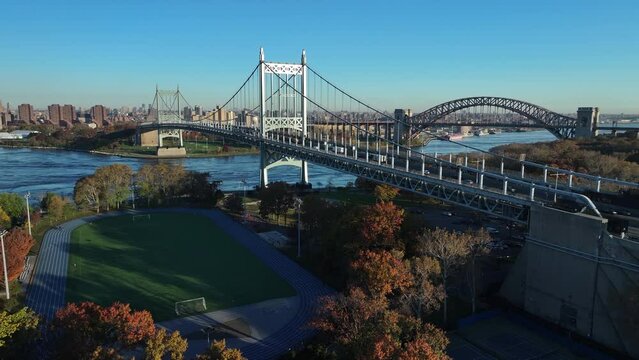 Aerial shot of Astoria Park on an autumn morning. Shot looking north over the track towards the Robert F. Kennedy Bridge and the Hell Gate Bridge.