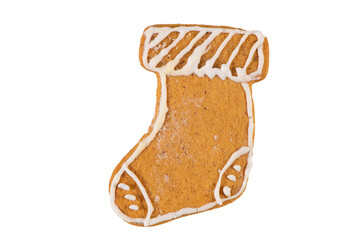 Cute fresh gingerbread christmas sock decorated with royal icing, isolated on white background. Christmas food, pastry background. New Year theme