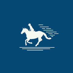 Silhouette of a man riding a horse against a blue sky