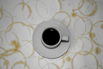 Cup of coffee and marks from the coffee cup. Coffee rings on a white background. Coffee stains on a white background.