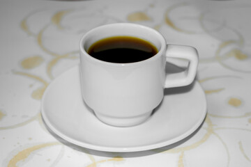 Cup of coffee and marks from the coffee cup. Coffee rings on a white background. Coffee stains on a white background.