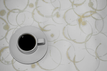 Cup of coffee and marks from the coffee cup. Coffee rings on a white background. Coffee stains on a white background.