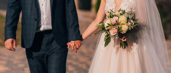 Closeup view of married couple holding hands