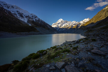View of Hooker lake in front and Mt.Cook, the highest peak of New Zealand, in the background, during the sunset.