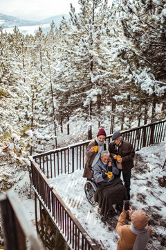 High angle view of senior friends on a balcony during winter in nature