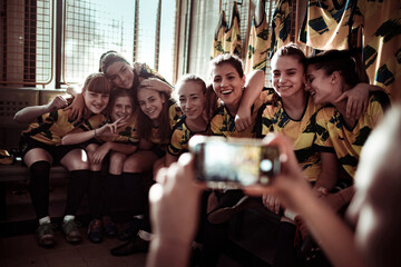 Youth Soccer Team posing for picture in locker room