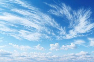 Wispy cirrus clouds streaking across a brilliant blue sky, creating a delicate contrast of...