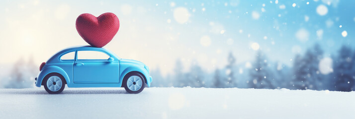 Blue toy car with red heart on winter snowy background