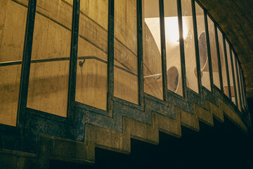 Glass window with stairs visible from the outside. Construction and nocturnal architecture