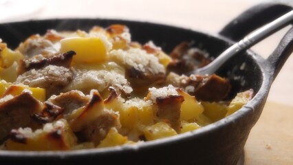 Hot Cheesy Potato and Meat Cast Iron Skillet Meal.