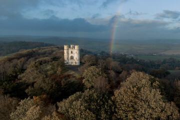 Haldon Belvedere (Lawrence Castle) in Haldon forest, Devon during golden hour with a stormy sky. 