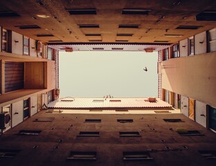 Escape to freedom. A building somewhere in Eastern Europe. - obrazy, fototapety, plakaty