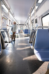 Woman passenger in Interior of subway train car in Washington DC Metro system