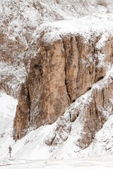 Fototapeta na wymiar Beautiful rocky mountain covered In snow, vertical