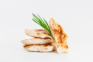 Chicken fillets fried until half cooked, semi-finished product with fresh herbs on a white background. Fast cooking.Fast homemade food.Fast food. Quick cooking at home. Copy space.