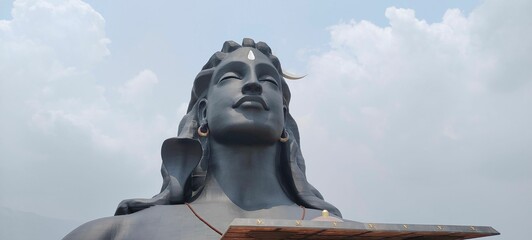 Panoramic shot of the Maha Shiva Adiyogi Statue under the clouds  in India