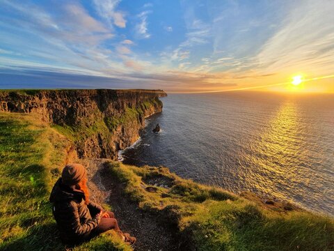 The Cliffs of Moher are sea cliffs located at the southwestern edge of the Burren region in County Clare, Ireland. They run for about 14 kilometres