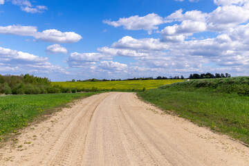 unpaved road in rural areas in spring, unpaved road