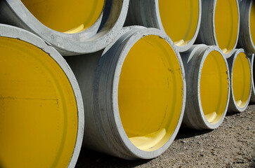 yellow pipes, pipes for construction, cement pipes, stacked pipes, yellow circles