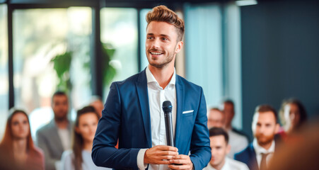young man confidently delivers an engaging corporate speech to inspire other young candidates to grow in the line of business