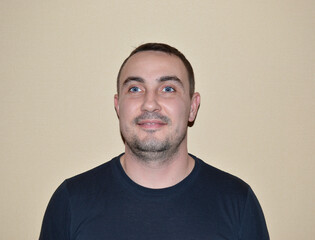 Obraz premium portrait of a young handsome man with blue eyes, light stubble and various emotions. young people leading a healthy lifestyle, open to communication, positive and friendly