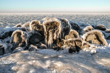 Closeup view of natural rock formation at the frozen shore