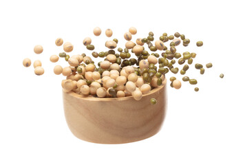 Mix green mung soy beans fall down explosion, several kind bean float explode in wooden bowl. Dried soybean green mung mixed beans splash throwing in Air. White background Isolated high speed shutter