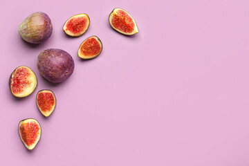 Fototapeta premium Fresh ripe figs on purple background