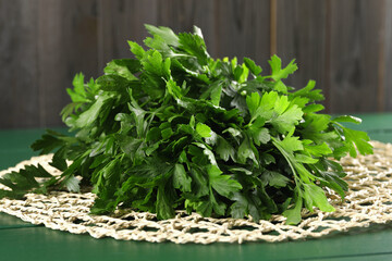 Fresh green parsley on wooden table, closeup