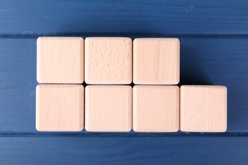 International Organization for Standardization. Cubes with abbreviation ISO and number 9001 on blue...
