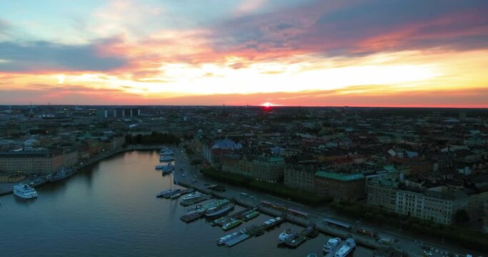 Aerial Forward Shot Of Cityscape During Sunset Against Sky - Stockholm, Sweden