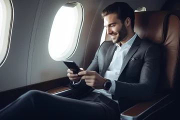 Foto op Canvas Portrait businessman sitting using smart phone inside airplane near the window, AI Generative © BOONJUNG