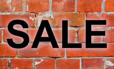 ビンテージなレンガの背景に、SALEのロゴがある広告の素材