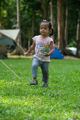 Little asian girl enjoying with camping site in mountain forest