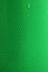 water drop on green beverage cans background, texture of cold aluminium package