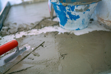 Mechanical man hand plaering cement interior floor building