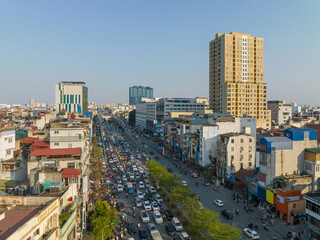 Hanoi cityscape at on Truong Chinh street with many vehicles on street.