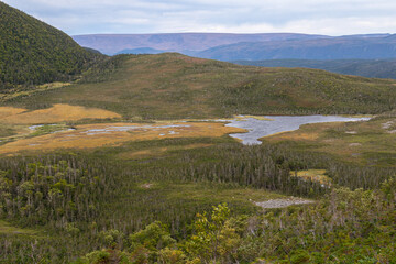 View of distant fiords and mountains from Ferry Gulch pass on Gros Morne mountain in Newfoundland...