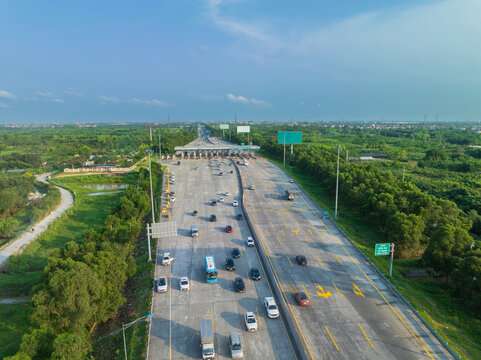 Aerial view of busy toll road with many cars queuing up to pay the highway toll on Road No. 5B connecting Hanoi to Hai Phong city.