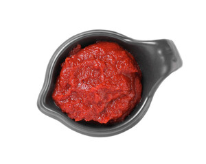 Gravy boat with tasty tomato paste isolated on white, top view