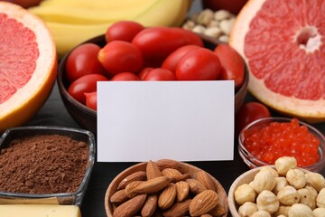 Many different products with blank card on table, closeup and space for text. Natural sources of serotonin
