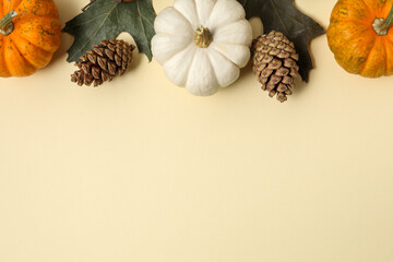 Thanksgiving day. Flat lay composition with pumpkins on beige background, space for text