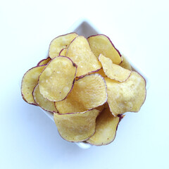 A portion of sweet potato chips isolated on white background