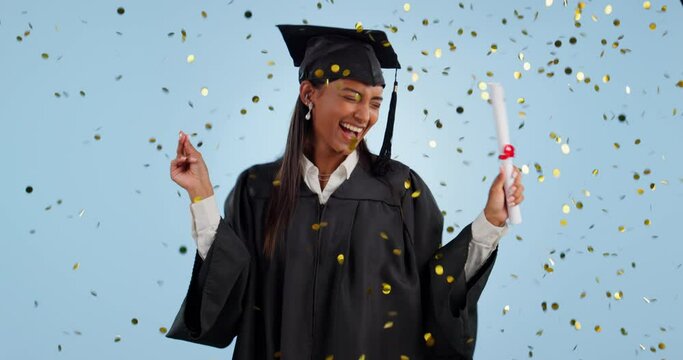 Happy woman, student and dancing in confetti for graduation celebration against a studio background. Excited female person or graduate with certificate, diploma or degree achievement in happiness